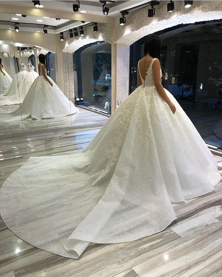 Sweetheart Spaghetti Strap Backless Ball Gown Wedding Dress with Lace Appliques and Sequins