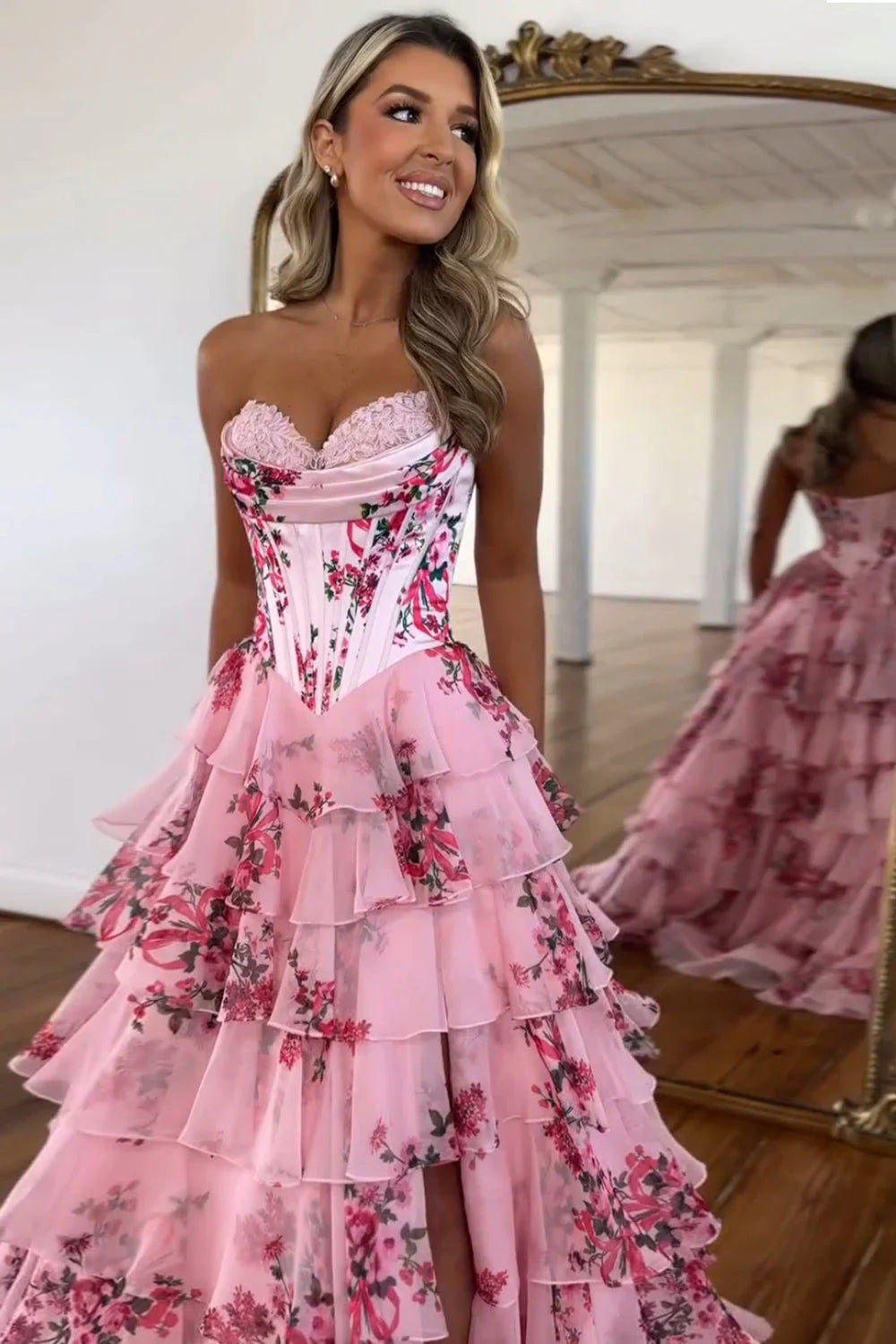 Babyonlines Detail of blush pink corset prom dress with floral embellishments